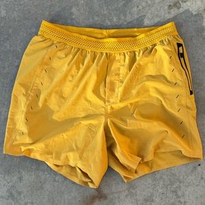 Ten thousand session short, 5”, yellow/gold, excellent condition (never worn)